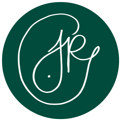 Caoimhe's logo. This is the main version version. It consists of a dark green circle with Caoimhe's signature in the center. The signature is white.